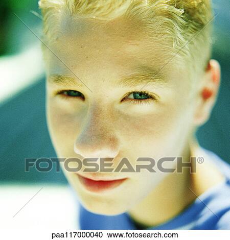 Boy looking into camera, portrait View Large Photo Image Stock Image - Boy looking into camera, portrait. Fotosearch