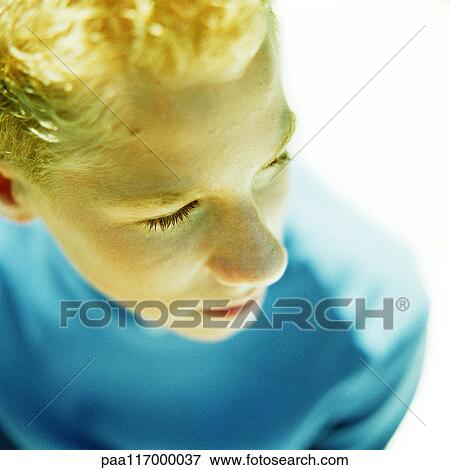 Boy's face, high angle view View Large Photo Image Stock Photo - Boy's face, high angle view. Fotosearch