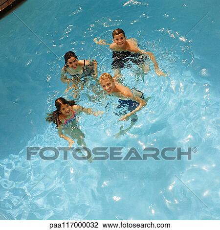 Children in swimming pool, elevated view View Large Photo Image Stock Image - Children in swimming pool, elevated view. Fotosearch