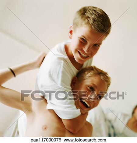 Stock Photograph - Two boys playfighting. Fotosearch