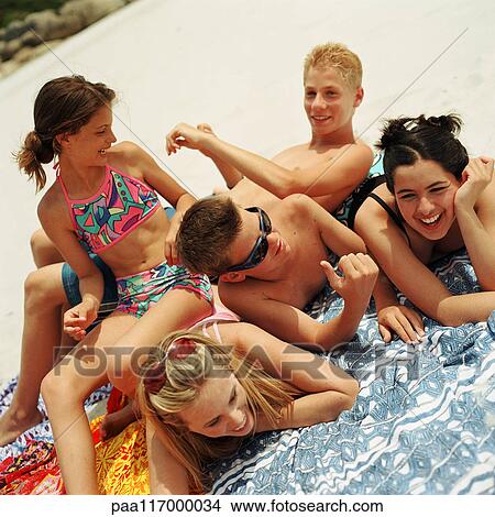 Picture - Young people on the beach. Fotosearch