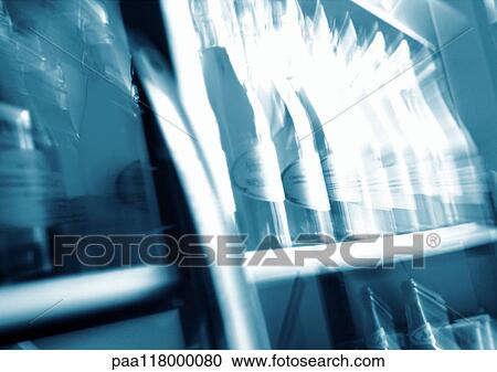 Bottles lined up on shelves, blurred View Large Photo Image Stock Image - Bottles lined up on shelves, blurred. Fotosearch