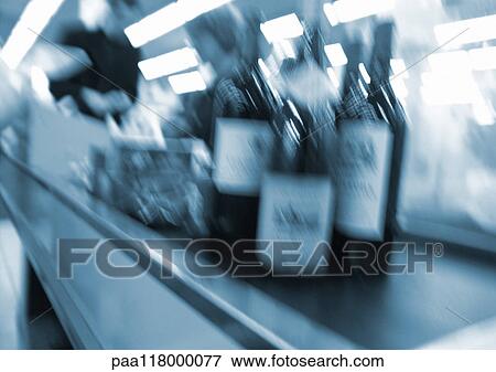 Bottles on conveyor belt at checkout counter, blurred View Large Photo Image Stock Photo - Bottles on conveyor belt at checkout counter, blurred. Fotosearch