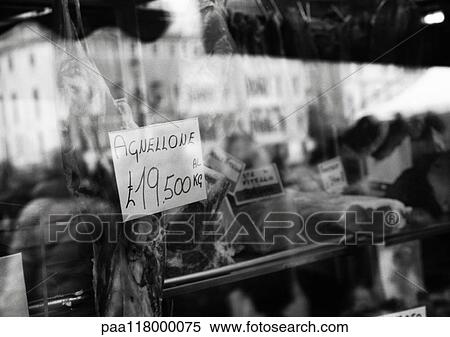 Butcher's shop, reflection of crowd, b&w View Large Photo Image Stock Photography - Butcher's shop, reflection of crowd, b&w. Fotosearch