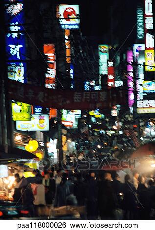 Stock Photograph - Crowded street at night, high angle view. Fotosearch
