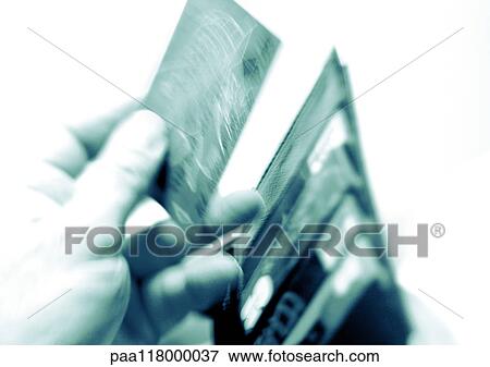 Hand taking card from billfold, close-up View Large Photo Image Stock Photo - Hand taking card from billfold, close-up. Fotosearch