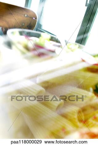 Pasta viewed through window, extreme close-up View Large Photo Image Stock Photo - Pasta viewed through window, extreme close-up. Fotosearch