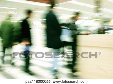 Stock Photography - People standing, superimposed image, blurred. Fotosearch