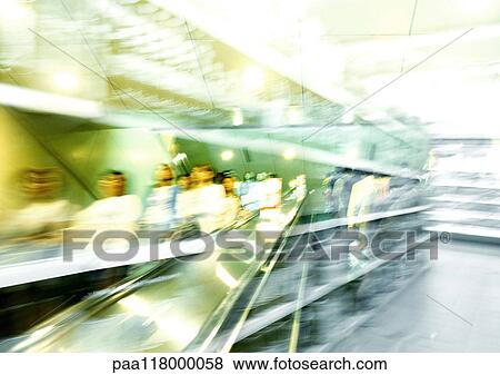 Shelves in supermarket and people on escalator, superimposed pictures, blurred View Large Photo Image Stock Photo - Shelves in supermarket and people on escalator, superimposed pictures, blurred. Fotosearch