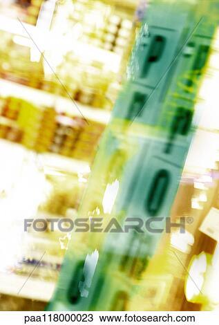 Stock Image - Supermarket shelves and "promo" text, blurred. Fotosearch