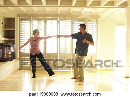 Stock Photo - Couple dancing in room. Fotosearch