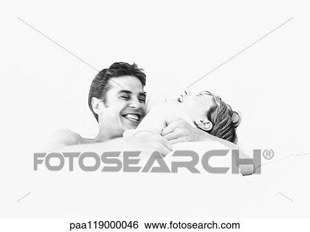 Stock Photograph - Couple laughing, b&w. Fotosearch