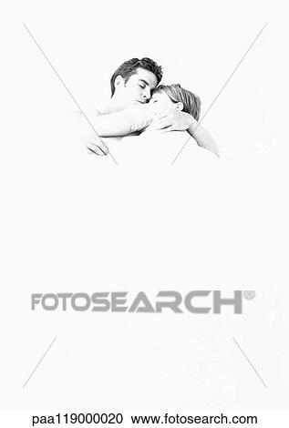 Couple lying in each other's arms, b&w View Large Photo Image Stock Image - Couple lying in each other's arms, b&w. Fotosearch