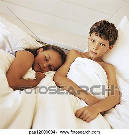 Children in bed View Large Photo Image Stock Photo - Children in bed. Fotosearch