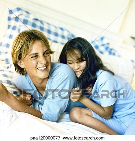 Children on bed View Large Photo Image Stock Photo - Children on bed. Fotosearch