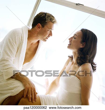 Couple sitting face to face View Large Photo Image Stock Image - Couple sitting face to face. Fotosearch