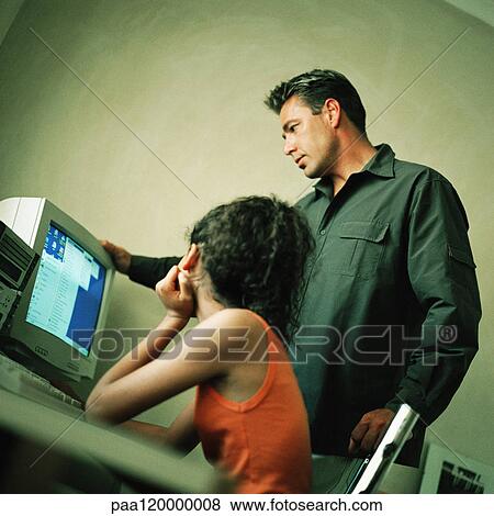 Stock Photo - Man and girl using computer. Fotosearch