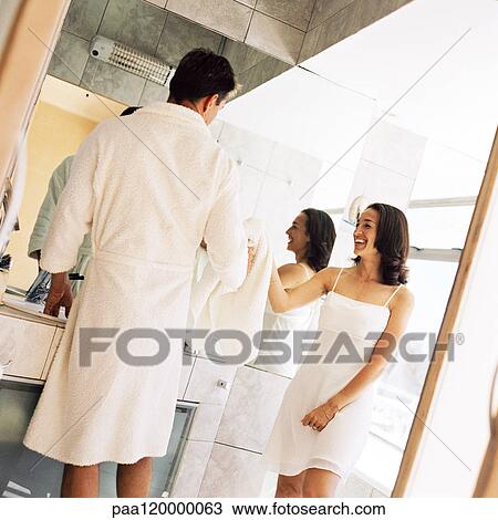 Man and woman standing in bathroom View Large Photo Image Stock Image - Man and woman standing in bathroom. Fotosearch