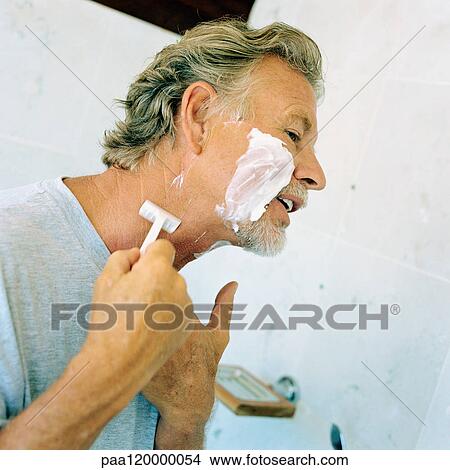 Mature man shaving, side view View Large Photo Image Picture - Mature man shaving, side view. Fotosearch