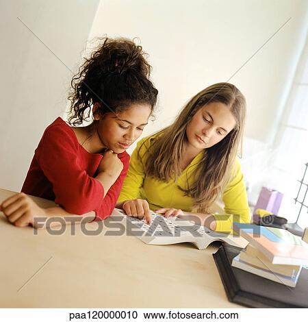 Two girls reading View Large Photo Image Stock Image - Two girls reading. Fotosearch