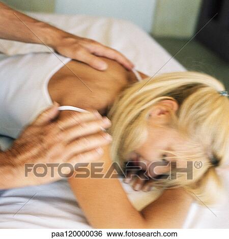 Woman being massaged on bed, close-up View Large Photo Image Stock Photograph - Woman being massaged on bed, close-up. Fotosearch