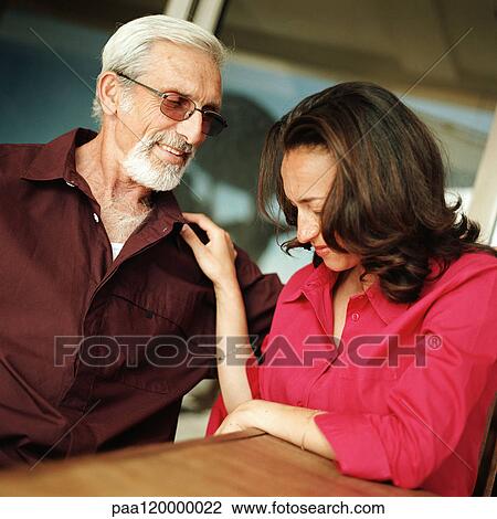 Woman with hand on senior man's shoulder View Large Photo Image Stock Image - Woman with hand on senior man's shoulder. Fotosearch