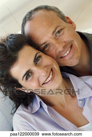 Couple side by side, smiling, portrait View Large Photo Image Stock Photo - Couple side by side, smiling, portrait. Fotosearch