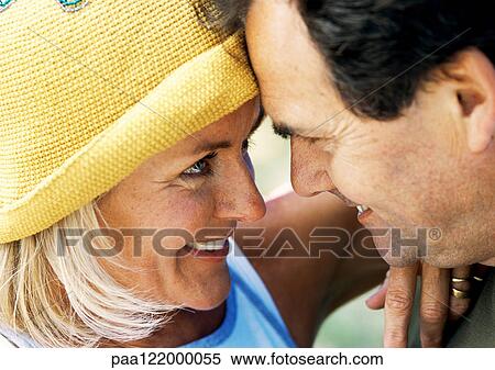 Couple with foreheads together, close-up View Large Photo Image Stock Photography - Couple with foreheads together, close-up. Fotosearch