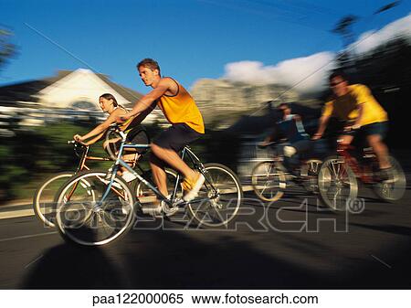 Family riding bikes, blurred motion View Large Photo Image Stock Photography - Family riding bikes, blurred motion. Fotosearch