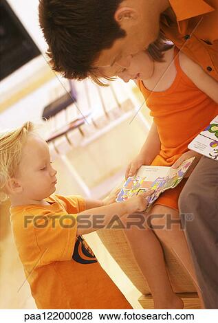 Father and children reading book, close-up View Large Photo Image Stock Photo - Father and children reading book, close-up. Fotosearch