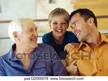 Grandfather, father and son, smiling, portrait View Large Photo Image Stock Photo - Grandfather, father and son, smiling, portrait. Fotosearch