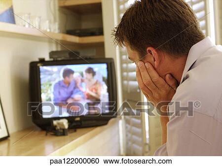 Man watching television, rear view View Large Photo Image Stock Image - Man watching television, rear view. Fotosearch