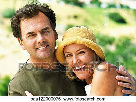 Mature man and woman smiling, portrait View Large Photo Image Stock Photograph - Mature man and woman smiling, portrait. Fotosearch