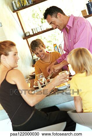Parents and children having meal View Large Photo Image Stock Image - Parents and children having meal. Fotosearch