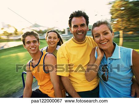 Parents and teenagers in park, portrait View Large Photo Image Stock Photo - Parents and teenagers in park, portrait. Fotosearch
