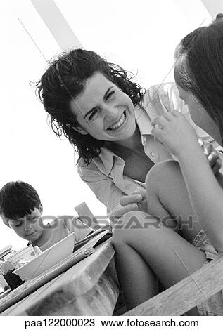 Woman and children at table, close-up, b&w View Large Photo Image Stock Image - Woman and children at table, close-up, b&w. Fotosearch