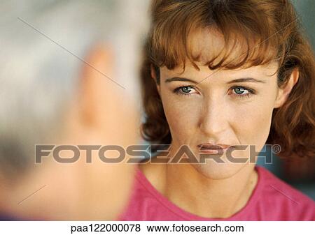 Woman looking at senior woman, close-up, blurred foreground View Large Photo Image Stock Photo - Woman looking at senior woman, close-up, blurred foreground. Fotosearch