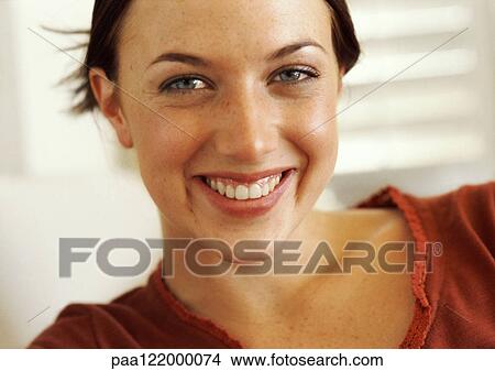 Woman smiling, close-up, portrait View Large Photo Image Picture - Woman smiling, close-up, portrait. Fotosearch