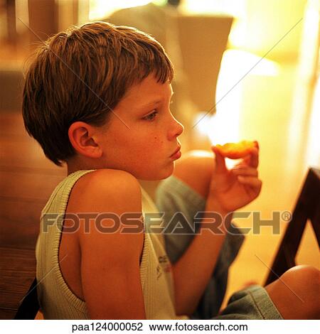 Child eating, side view View Large Photo Image Stock Image - Child eating, side view. Fotosearch