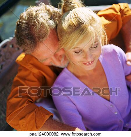 Couple smiling, high angle view View Large Photo Image Stock Image - Couple smiling, high angle view. Fotosearch