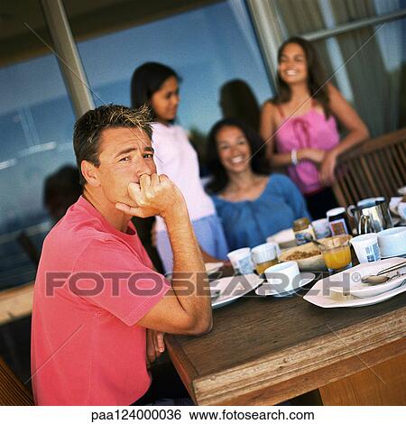 Family having breakfast, focus on father View Large Photo Image Stock Photograph - Family having breakfast, focus on father. Fotosearch