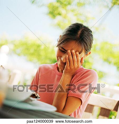 Girl with hand on face, close-up View Large Photo Image Stock Photo - Girl with hand on face, close-up. Fotosearch