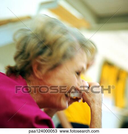Mature woman holding teacup, side view, blurred View Large Photo Image Stock Image - Mature woman holding teacup, side view, blurred. Fotosearch