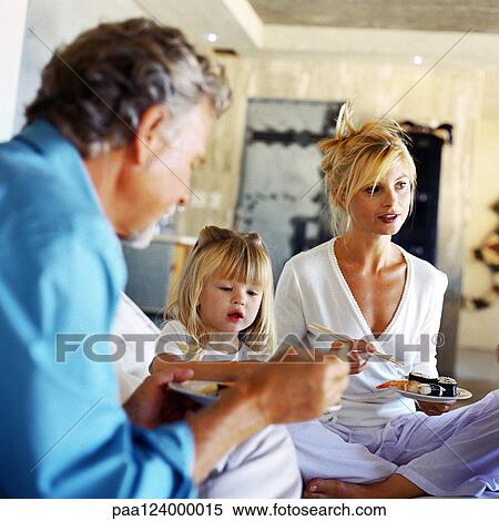 Parents and daughter eating View Large Photo Image Stock Photography - Parents and daughter eating. Fotosearch