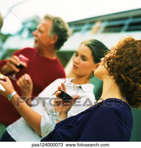 Teenage girl standing between man and woman View Large Photo Image Stock Image - Teenage girl standing between man and woman. Fotosearch