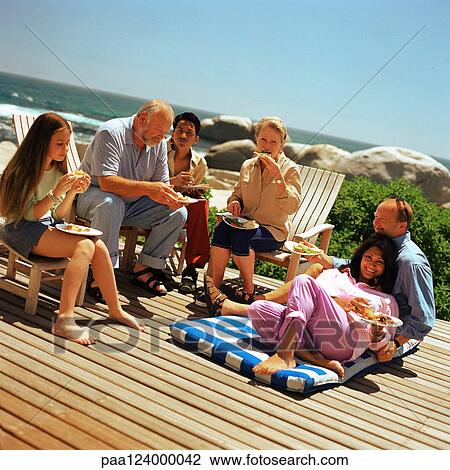 Two mature couples and children eating outside View Large Photo Image Stock Image - Two mature couples and children eating outside. Fotosearch