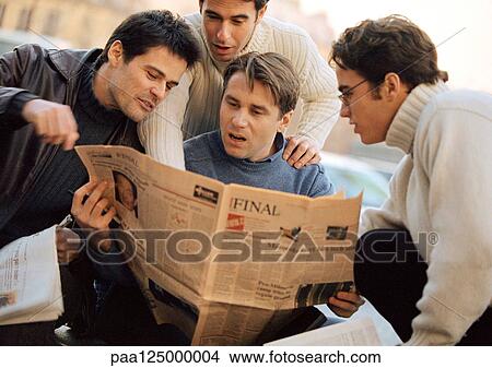 Four men looking at newspaper View Large Photo Image Picture - Four men looking at newspaper. Fotosearch