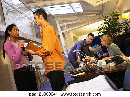 Stock Image - Four people in office. Fotosearch