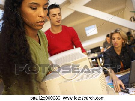 Man and woman carrying computer monitors in office View Large Photo Image Stock Image - Man and woman carrying computer monitors in office. Fotosearch