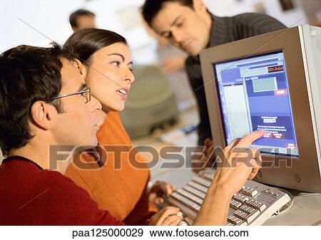 Stock Photo - People working in office, close-up. Fotosearch